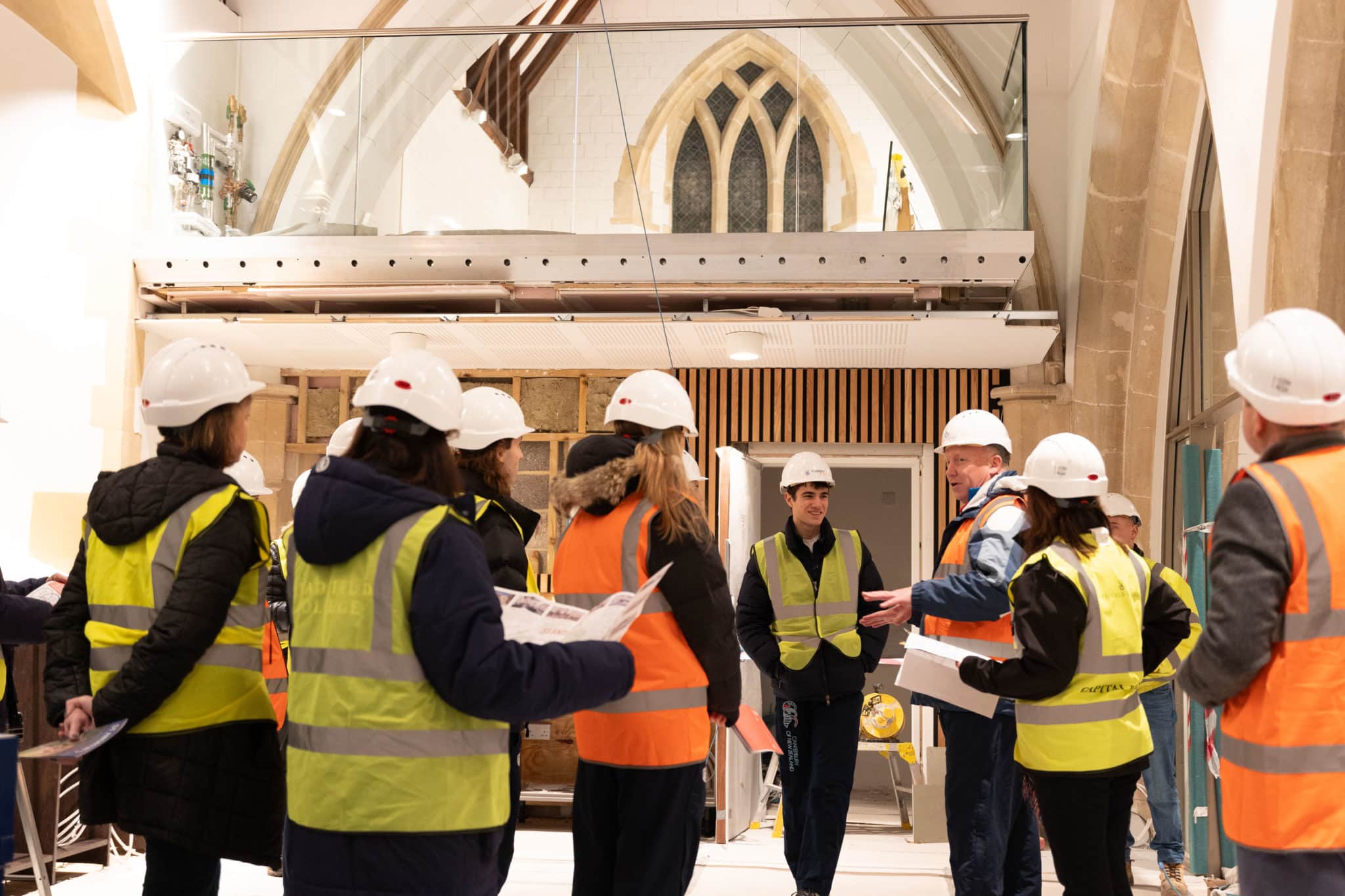 Al MacEwen delivering a brief in the cafe area, with the North Aisle Mezzanine study area in the rear