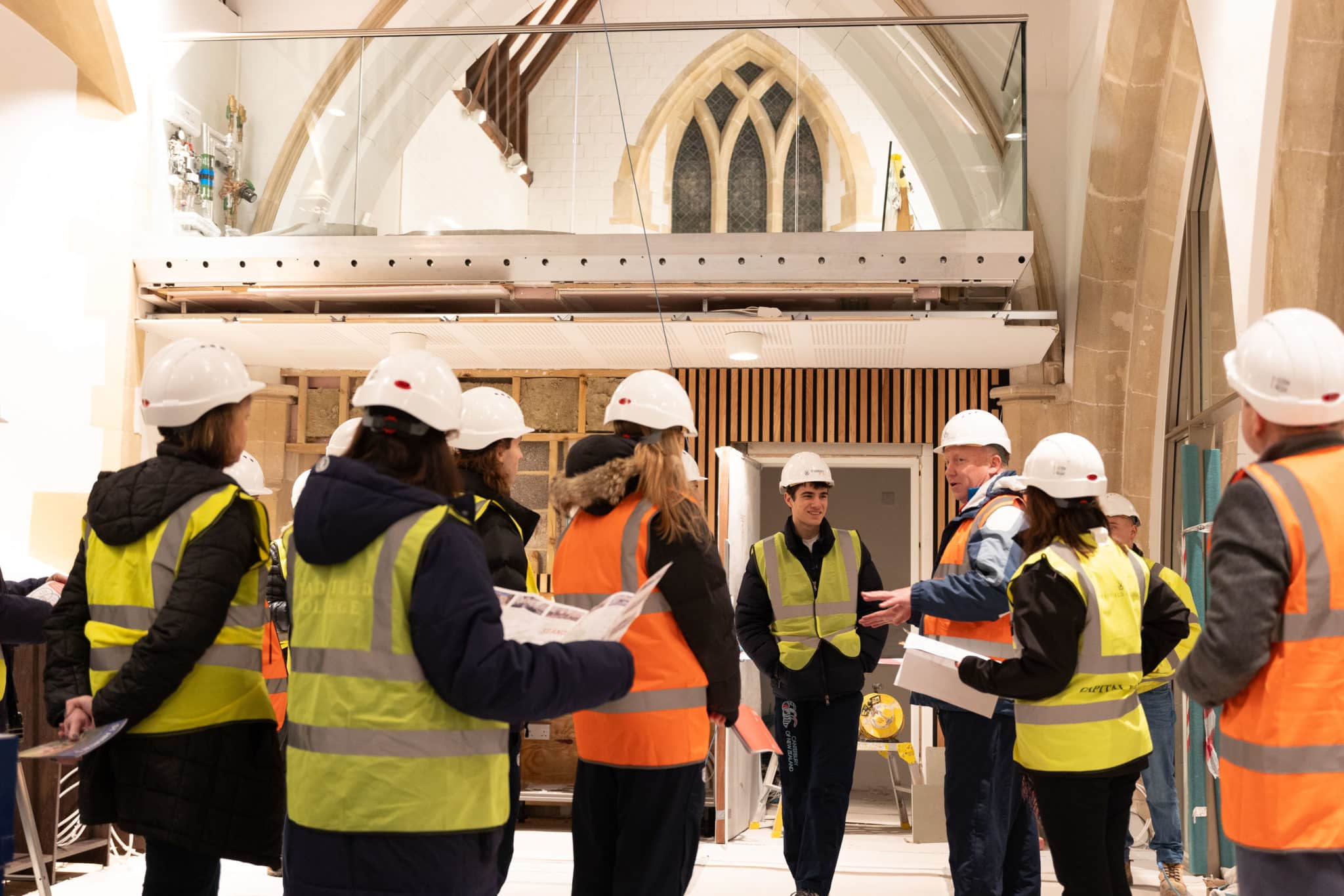 Al MacEwen delivering a brief in the cafe area, with the North Aisle Mezzanine study area in the rear
