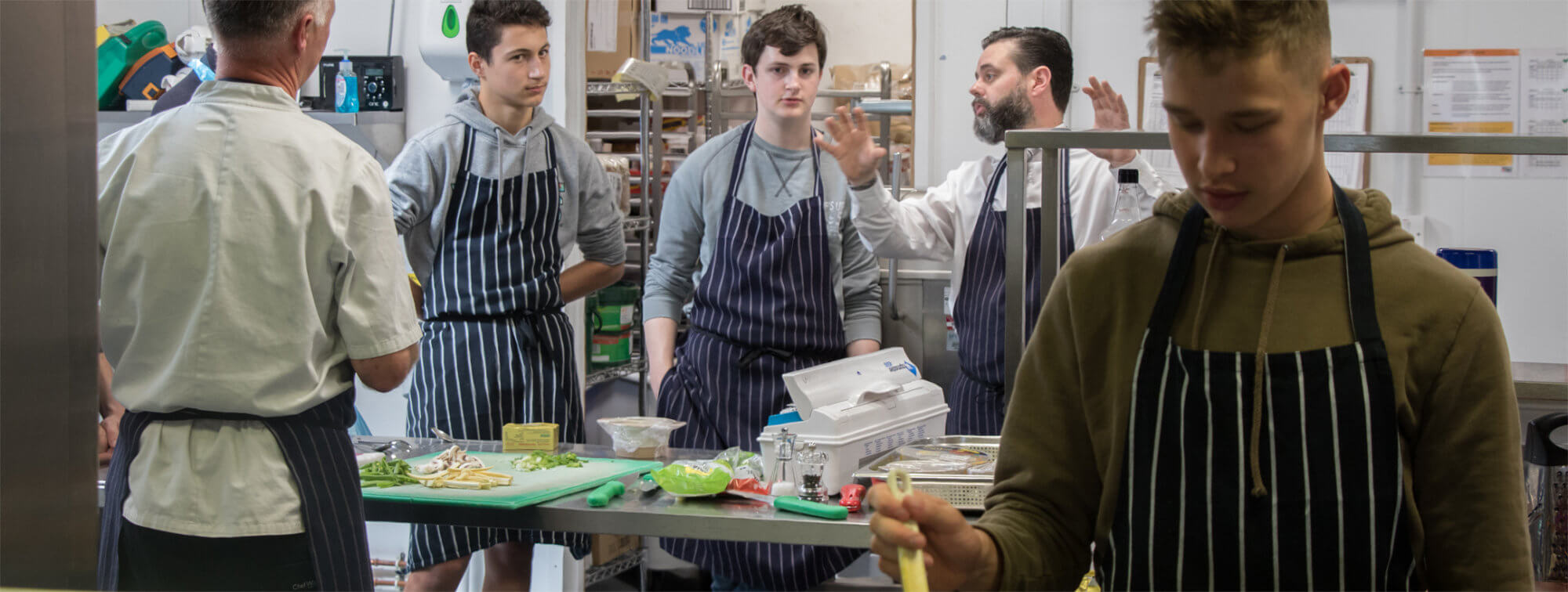 Sixth Formers receive some cooking tips from our catering team